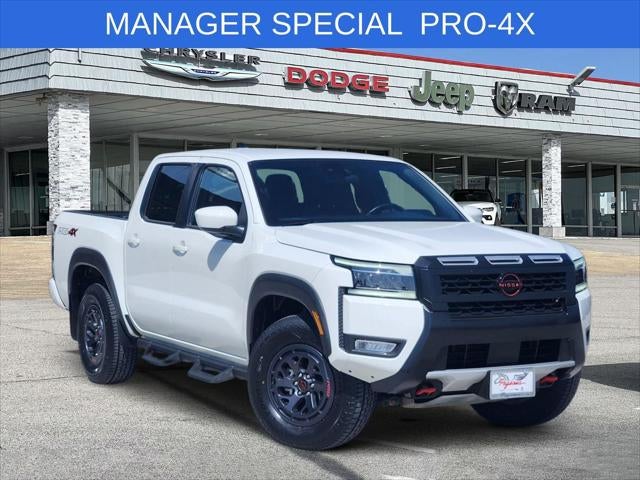 2025 Nissan Frontier Crew Cab PRO-4X 4x4 in Glacier White — front three-quarter view