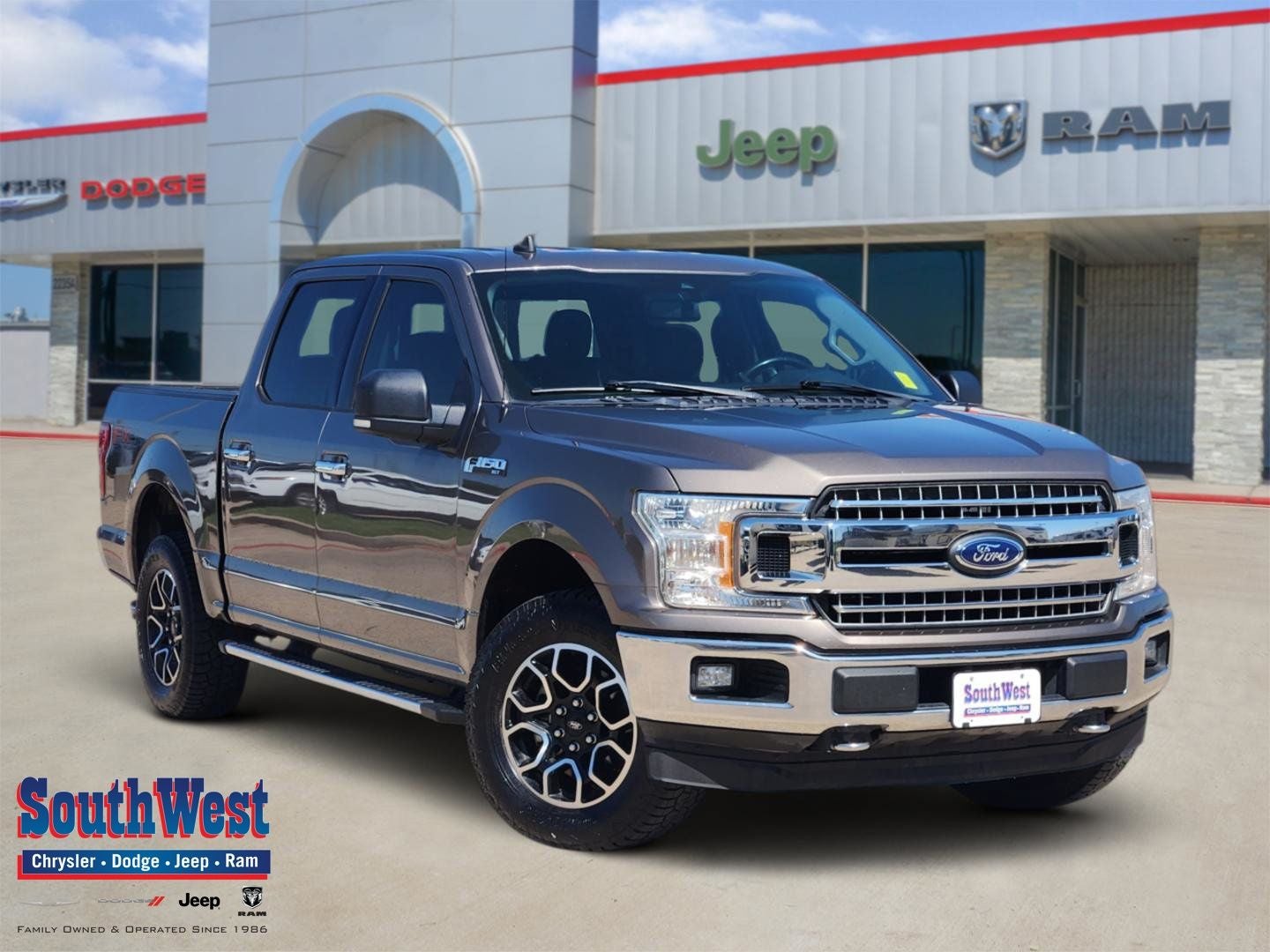 2019 Ford F-150 XLT in Stone Gray — front three-quarter view