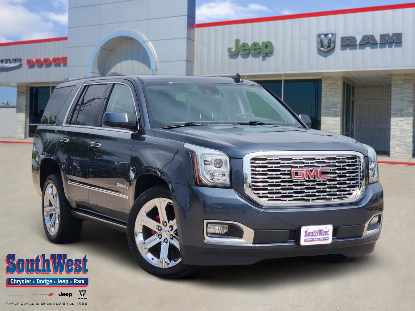 2020 GMC Yukon 4WD Denali in Dark Sky Metallic — front three-quarter view