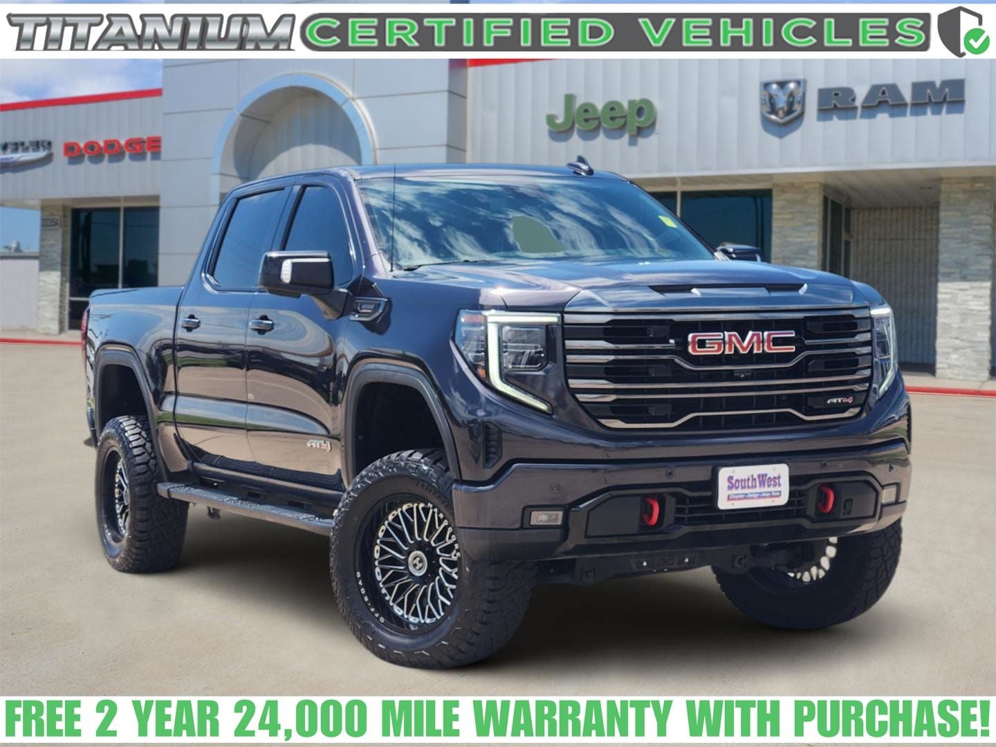 2023 GMC Sierra 1500 4WD Crew Cab Short Box AT4 in Titanium Rush Metallic — front three-quarter view