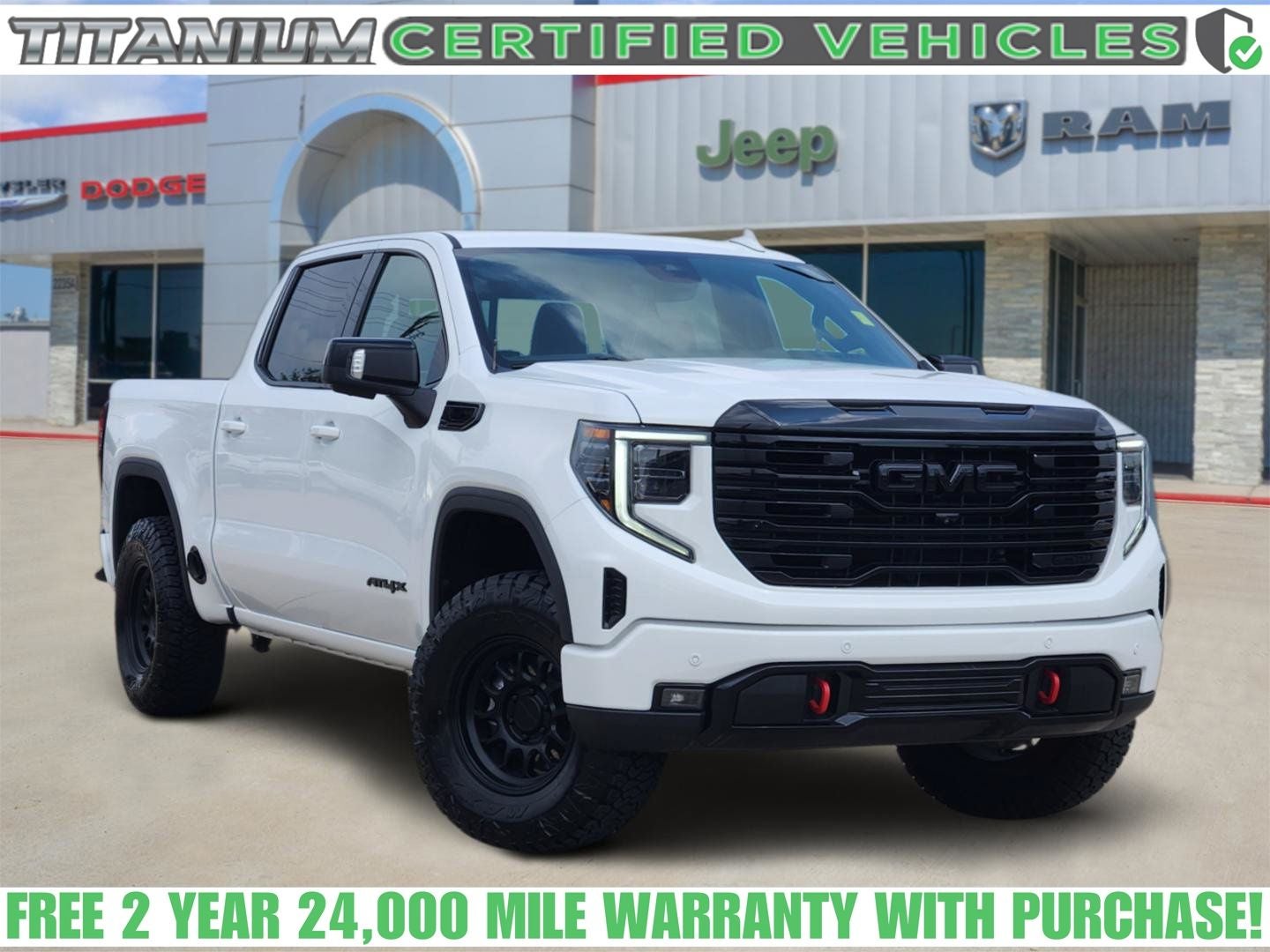 2023 GMC Sierra 1500 4WD Crew Cab Short Box AT4X in Summit White — front three-quarter view
