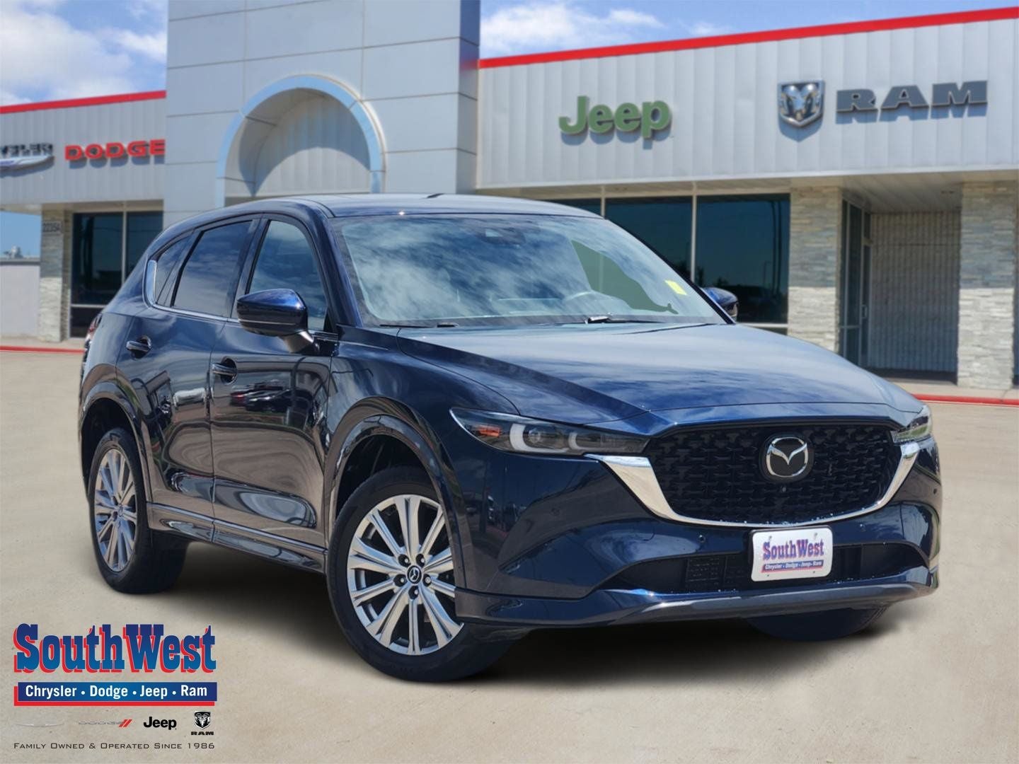 2023 Mazda Mazda CX-5 2.5 Turbo Signature in Deep Crystal Blue Mica — front three-quarter view
