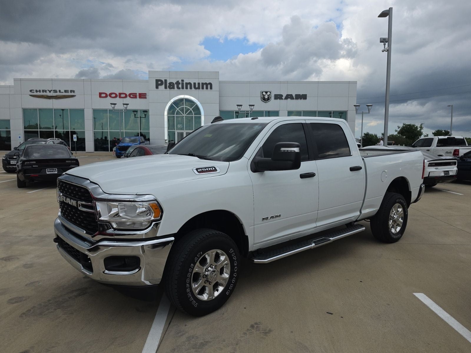 2024 RAM Ram 2500 Big Horn Crew Cab 4x4 6'4' Box in Bright White Clearcoat — front three-quarter view