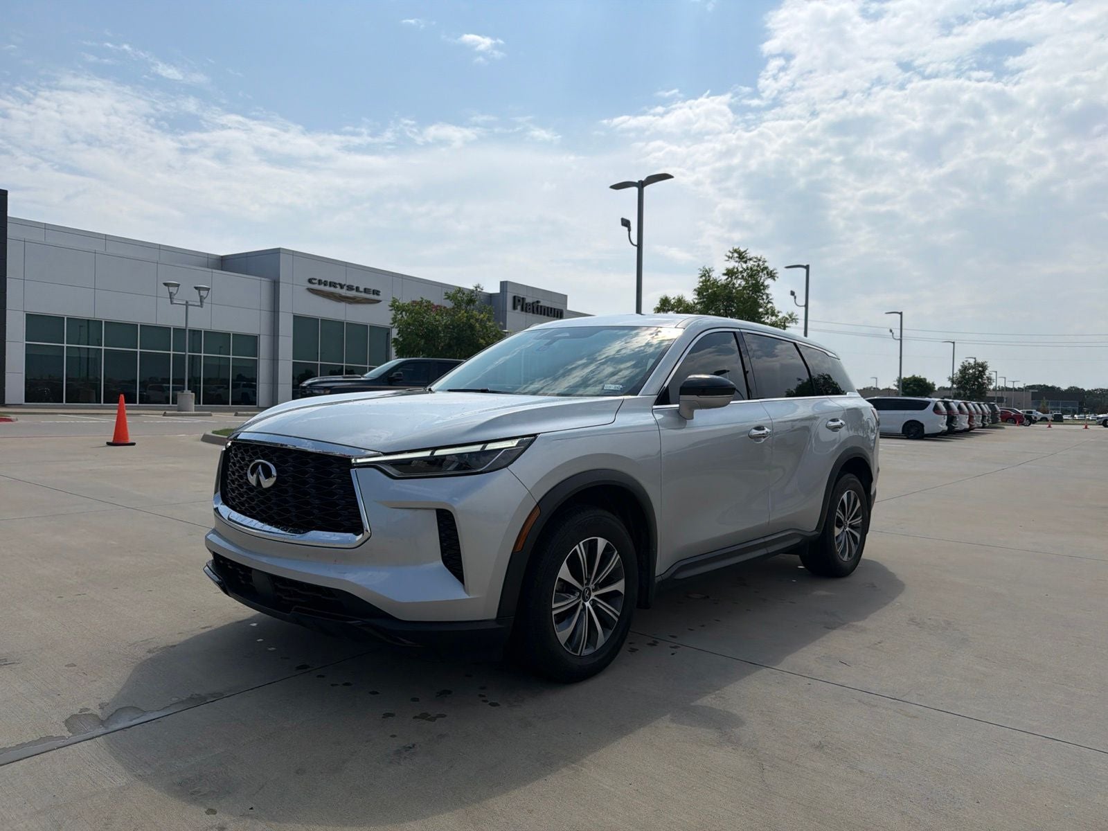 2023 INFINITI QX60 PURE in Liquid Platinum — front three-quarter view