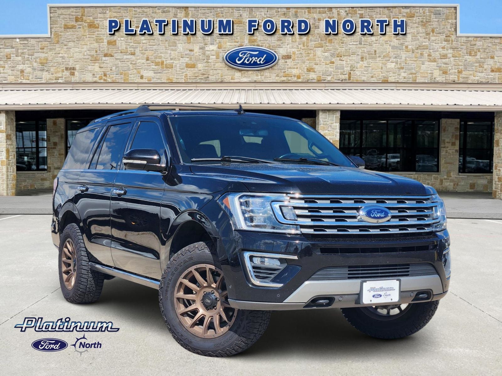 2021 Ford Expedition Limited in Black Metallic — front three-quarter view
