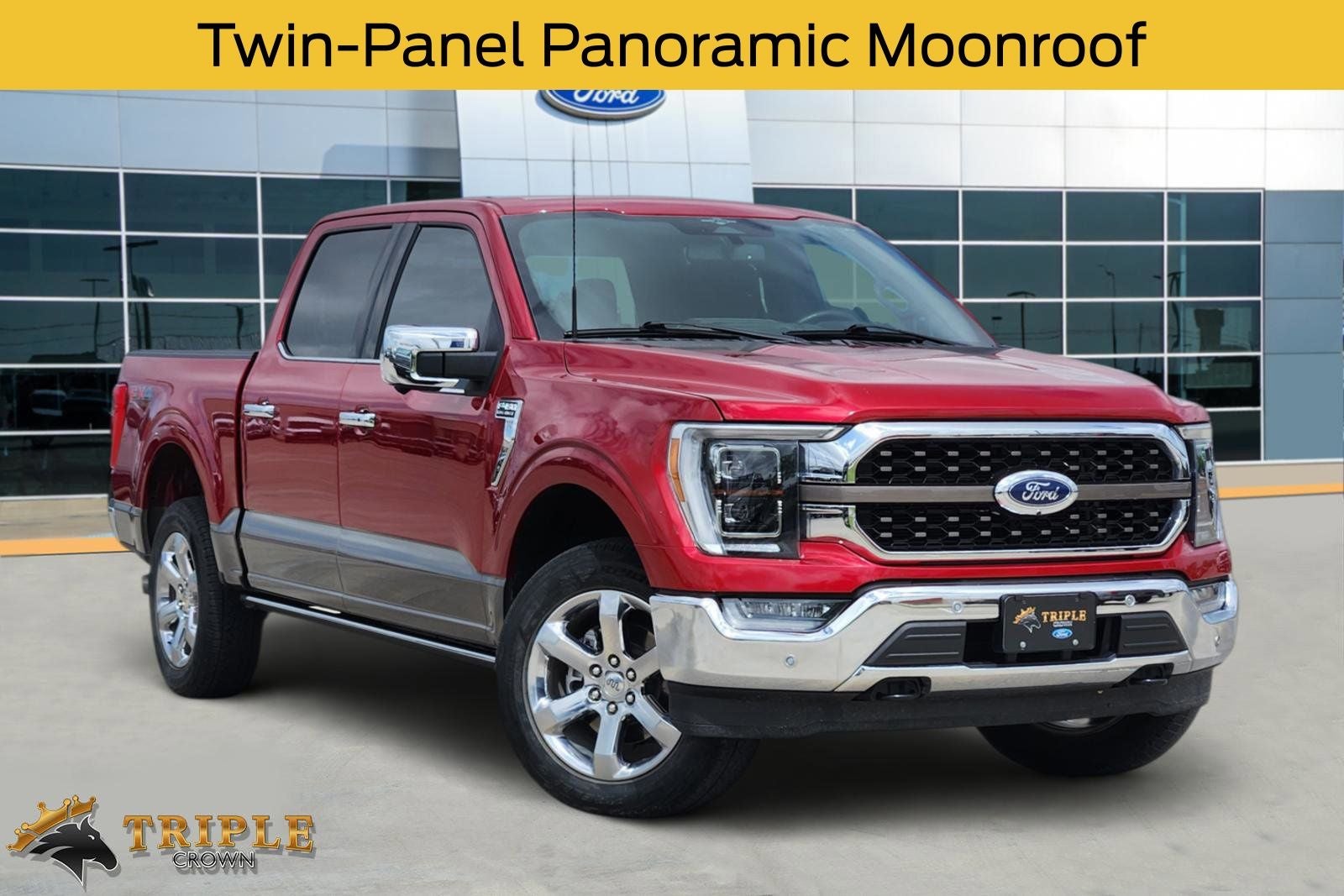 2023 Ford F-150 King Ranch in Rapid Red Metallic Tinted Clearcoat — front three-quarter view