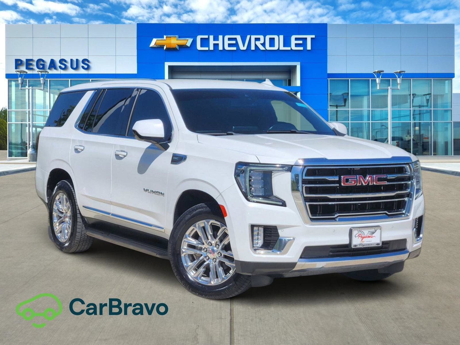 2023 GMC Yukon SLT in Summit White — front three-quarter view